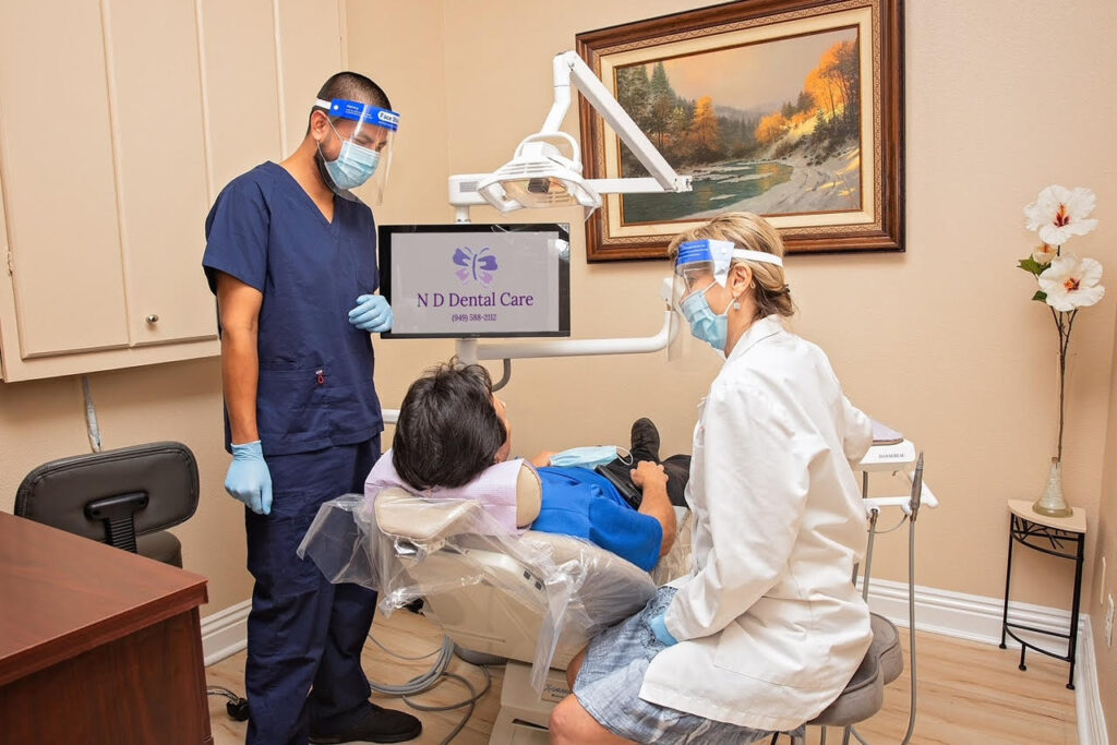 Laguna Hills dentist discussing exam results with patient at ND Dental Care